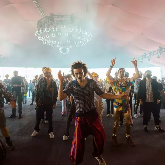 Festival attendees dance at the Portola Music Festival